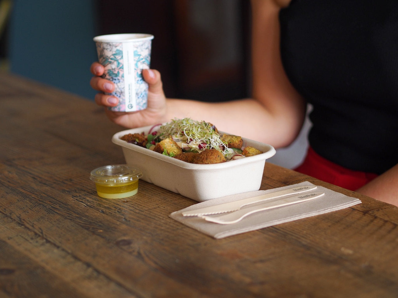 rectangular takeaway container with disposable coffee cup and wooden cutlery