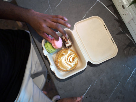 bagasse clamshell takeaway container size 7x5 containing colourful macarons and various cakes