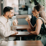 a couple enjoying milkshakes in custom printed disposable clear cups and lids