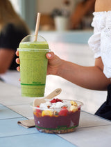 compostable pla cup with domed lid and paper straw with  pla compostable snack pot serving an acai bowl