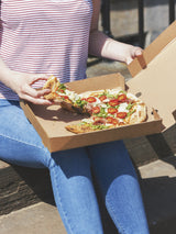 takeout pepperoni pizza in a kraft pizza box