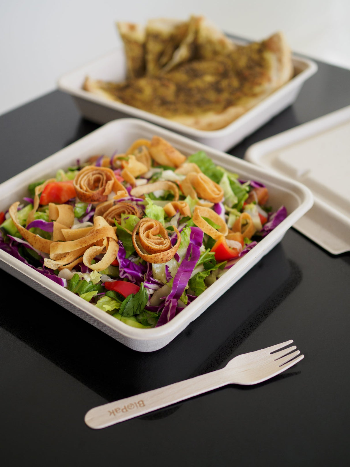 large 1750ml square takeaway container base and wooden fork serving a fresh takeout salad